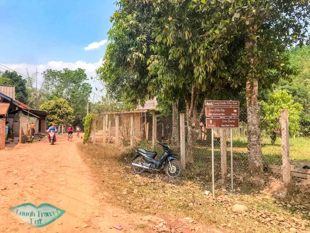 brown-valley-cycling-route-sign-luang-namtha-laos-laugh-travel-eat