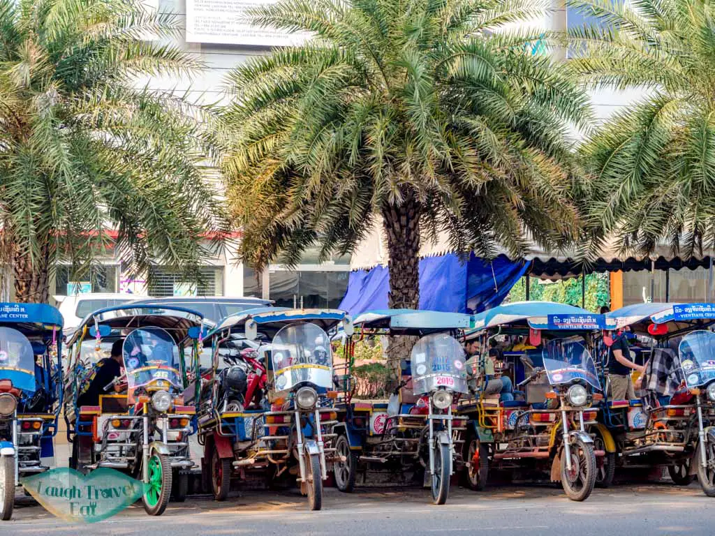 row-of-tuk-tuk-on-the-street-vientiane-laos-laugh-travel-eat