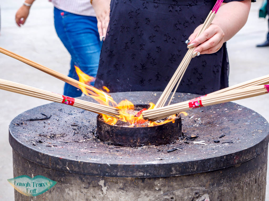 incense burning outside Longhua temple shanghai china