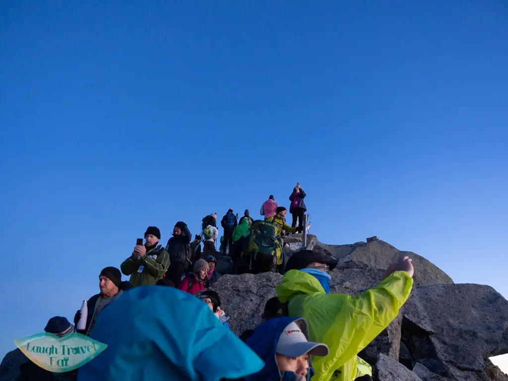 crowd-awaiting-sunrise-on-lows-peak-mount-kinabalu-sabah-malaysia-laugh-travel-eat