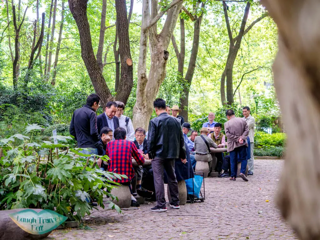 old man playing chess  people's park shanghai china