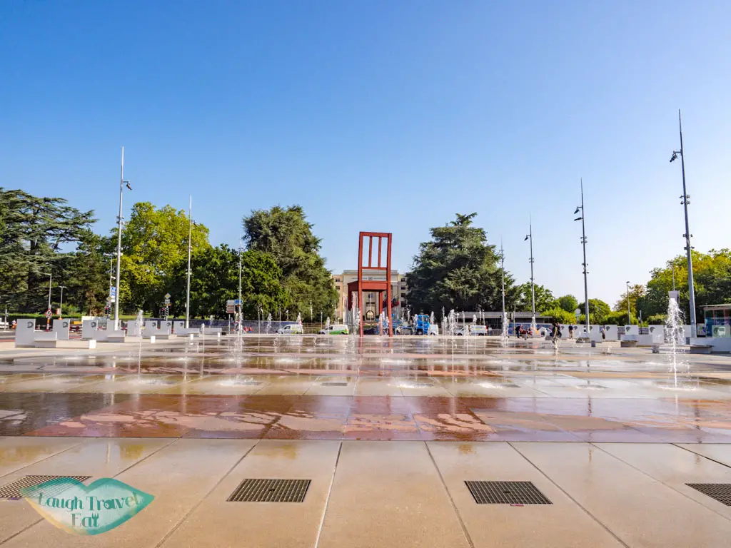 Palais de Nation fountain geneva switzerland - laugh travel eat