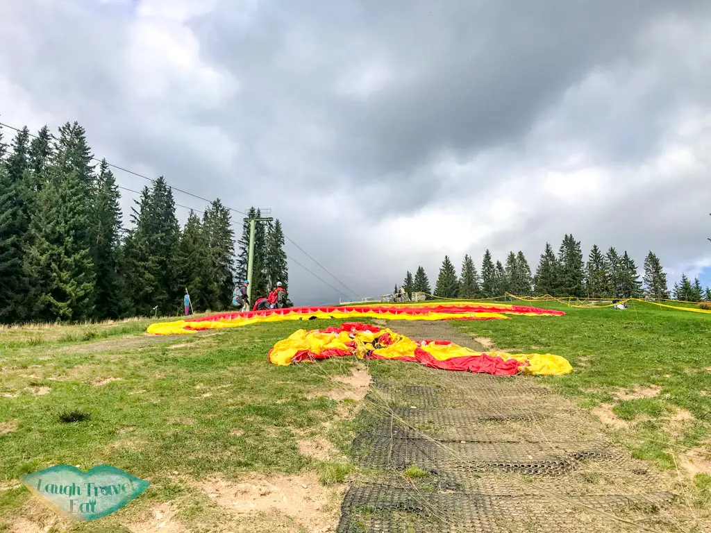 getting ready for paragliding interlaken Switzerland - laugh travel eat