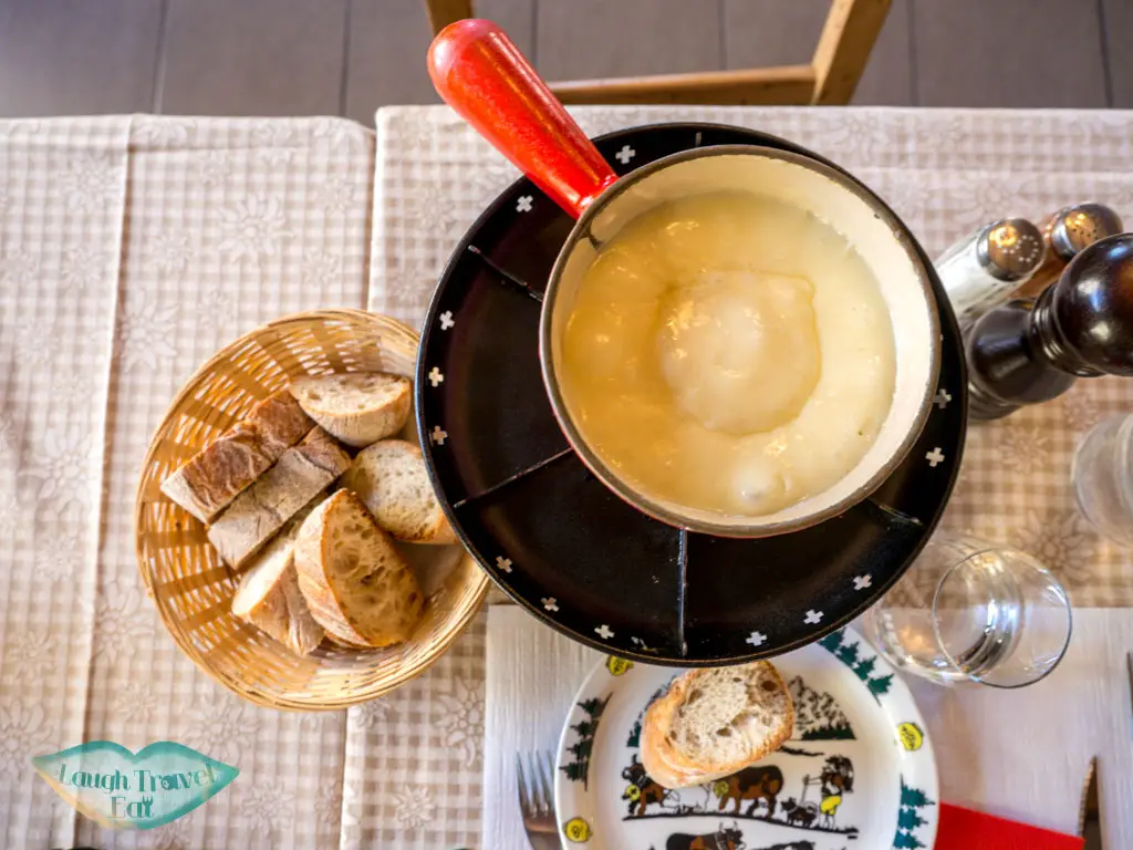 house cheese fondue Auberge de Saviese restaurant geneva switzerland - laugh travel eat