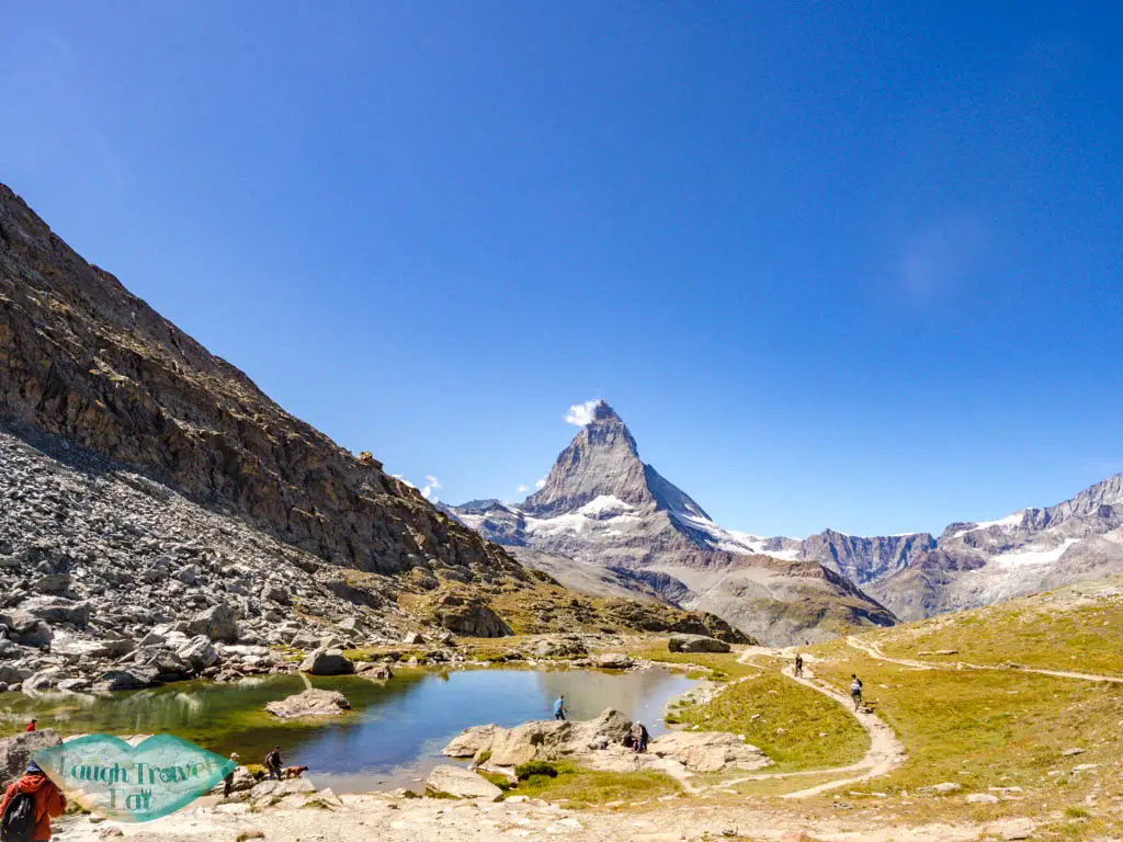 small lake before riffelsee zermatt switzerland - laugh travel eat