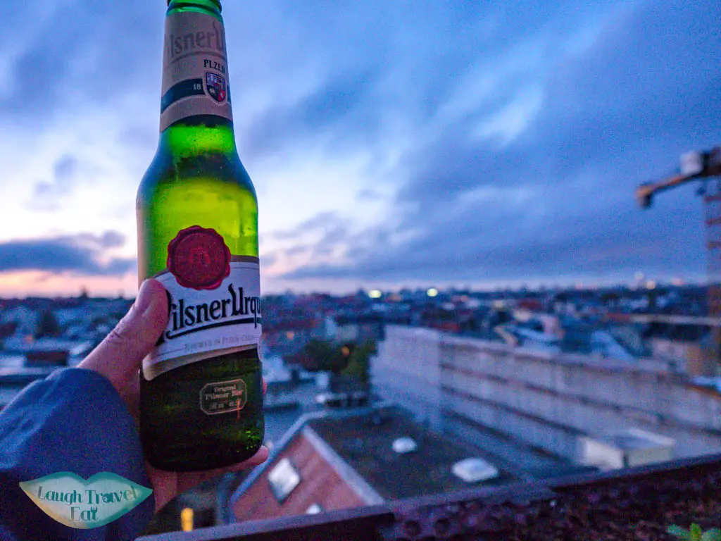 a beer at Klunkerkranich berlin germany - laugh travel eat