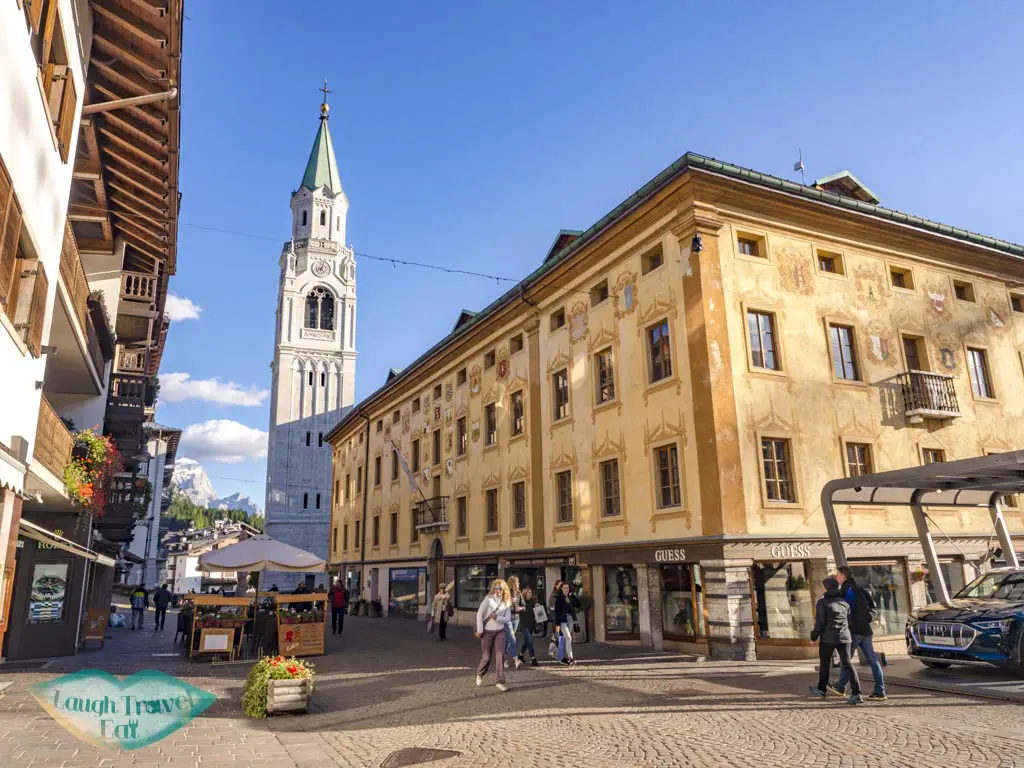 tower and town cortina d'ampezzo dolomites italy - laugh travel eat