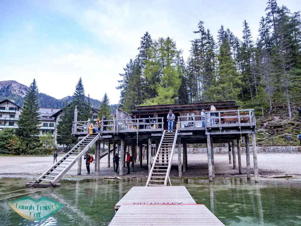 pier of lago di braies dolomites italy - laugh travel eat