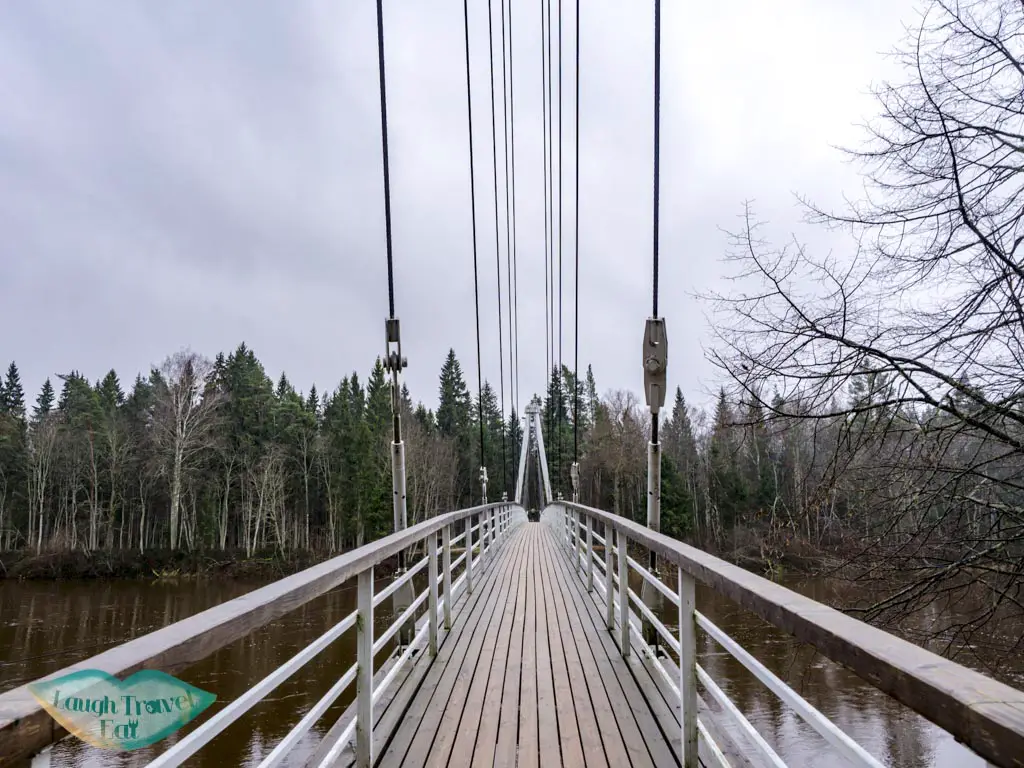 bridge across river gauja national park latvia - laugh travel eat