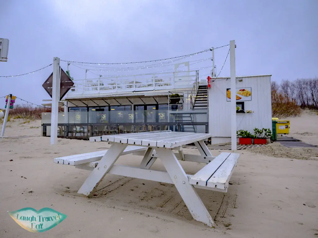 red sun buffet by white sand beach liepaja latvia - laugh travel eat
