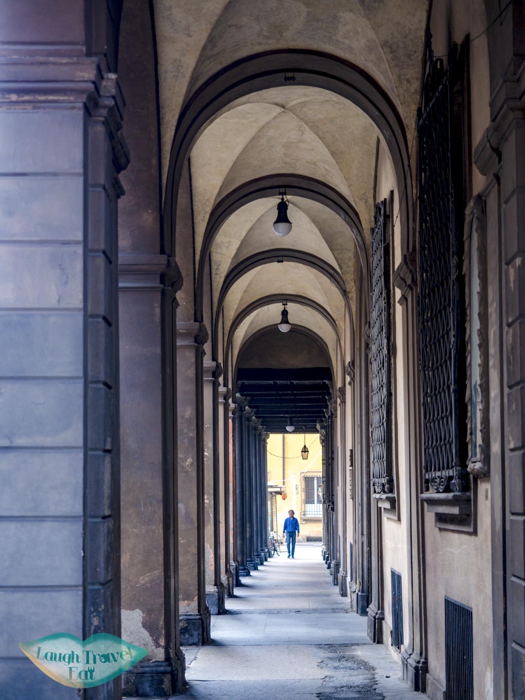 restaurants at a covered walkway bologna emilia romagna italy - laugh travel eat-3