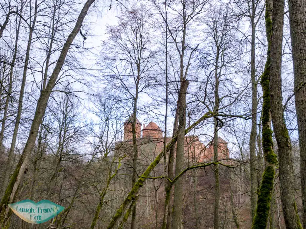 turaida castle from afar gauja national park latvia - laugh travel eat