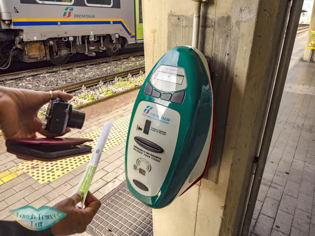 train ticket buying and validating italy - laugh travel eat