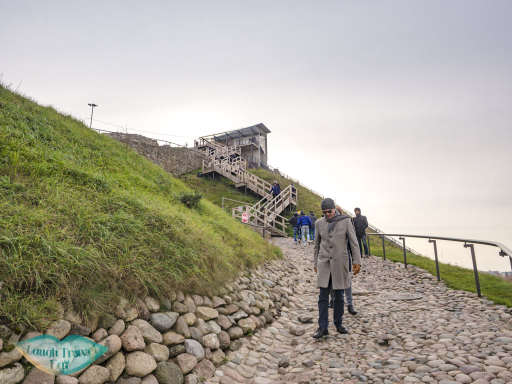 walk up to gedinimas castle vilnius lithuania - laugh travel eat
