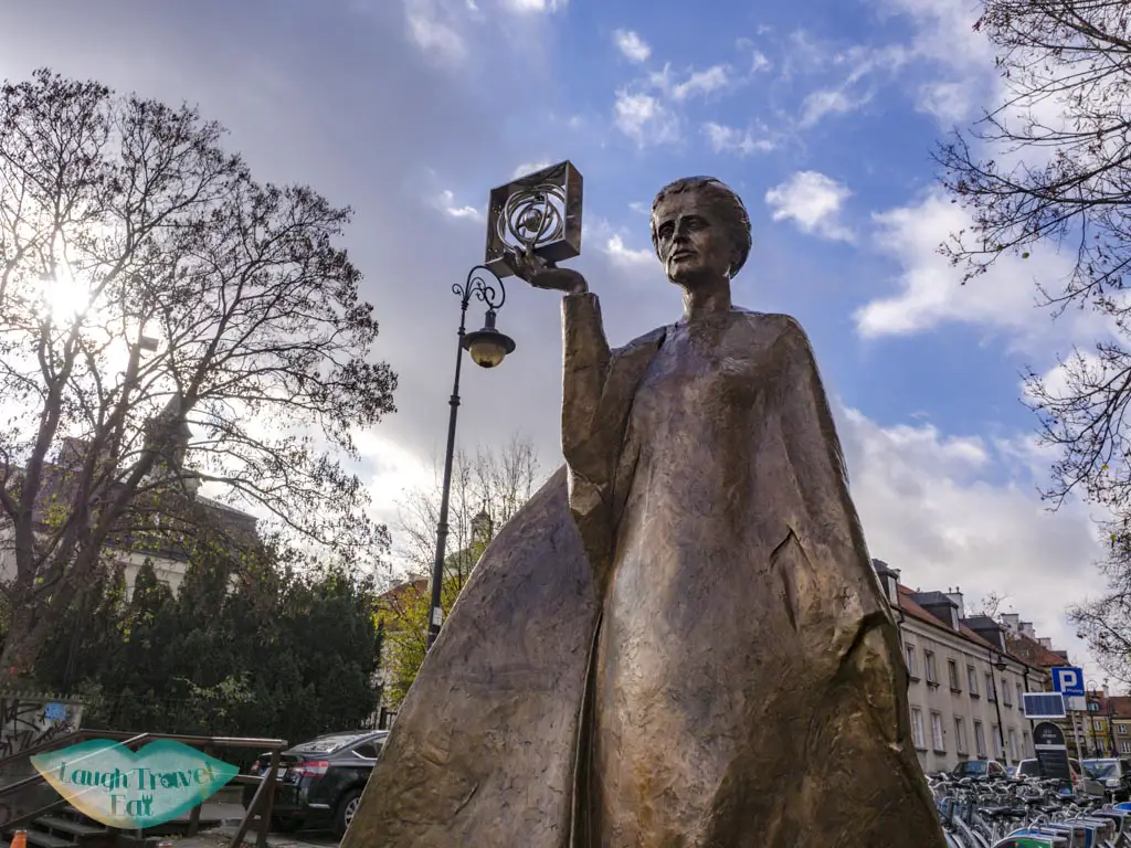 marie curie statue warsaw poland - laugh travel eat