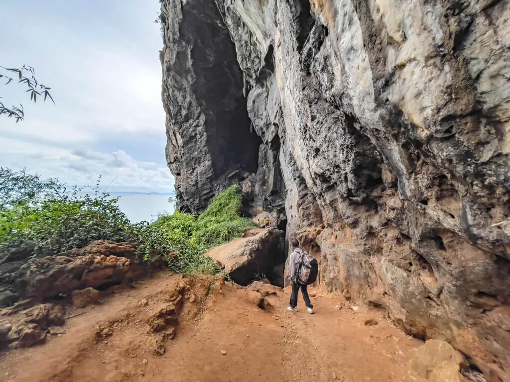 going up to bat cave rock climbing railey krabi thailand - laugh travel eat