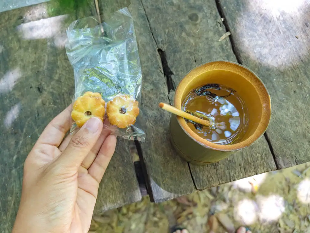 hot tea and biscuit bamboo raft with khao sok lake khao sok national park Thailand - laugh travel eat
