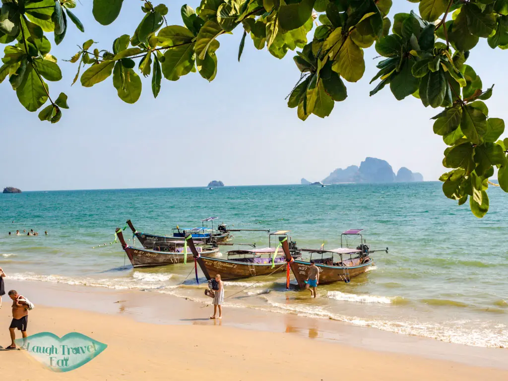 longtail boat to railay beach ao nang krabi thailand - laugh travel eat