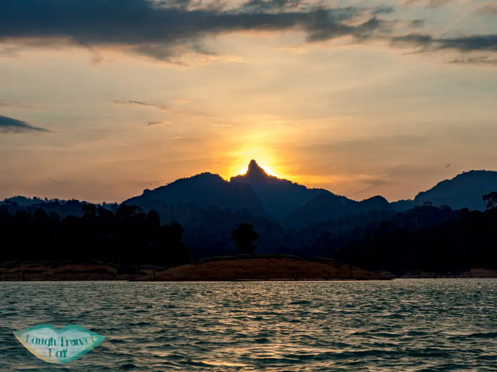 sunset cheow lan lake khao sok thailand - laugh travel eat