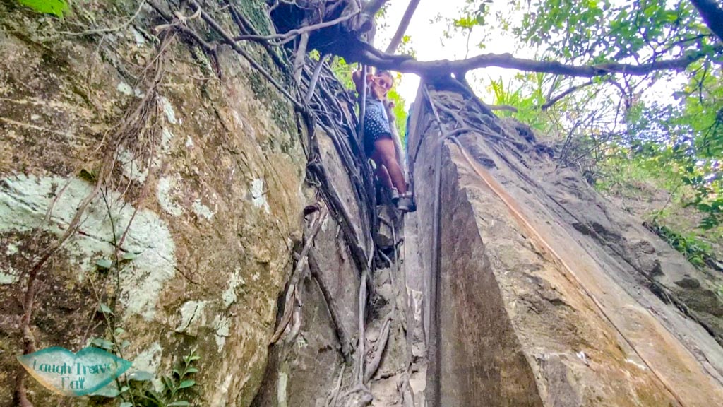 getting out of open book cliff pak lung stream lantau island hong kong - laugh travel eat