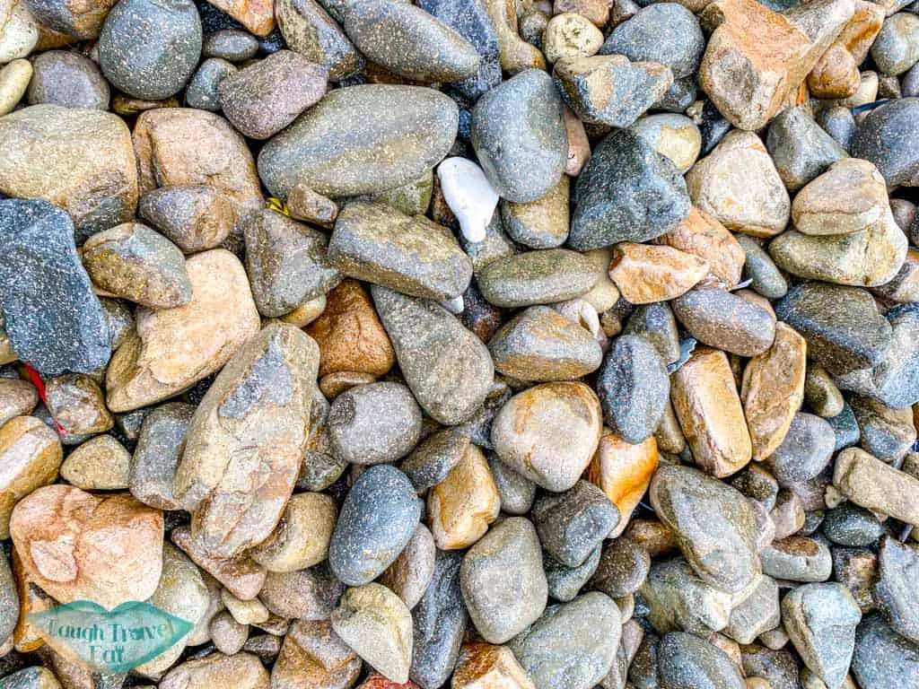 pebbles at first pebble beach basalt island sai kung hong kong - laugh travel eat