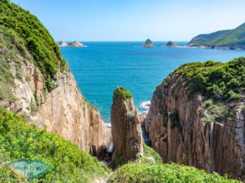 clasped hand rock bluff island sai kung hong kong - laugh travel eat