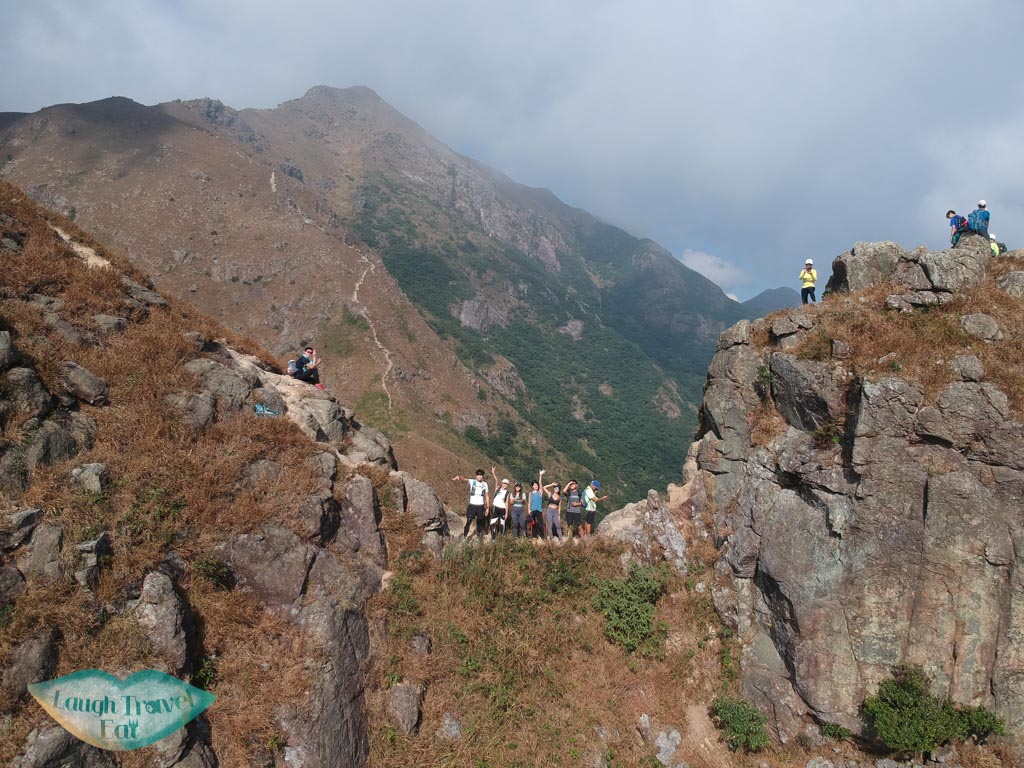 drone shot at one line of survivability kau nga range trail lantau island hong kong - laugh travel eat