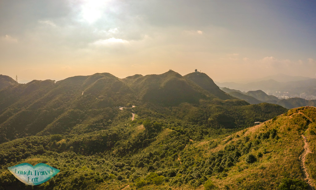 drone shot silver grass kowloon peak range from tung yeung shan kowloon hong kong - laugh travel eat