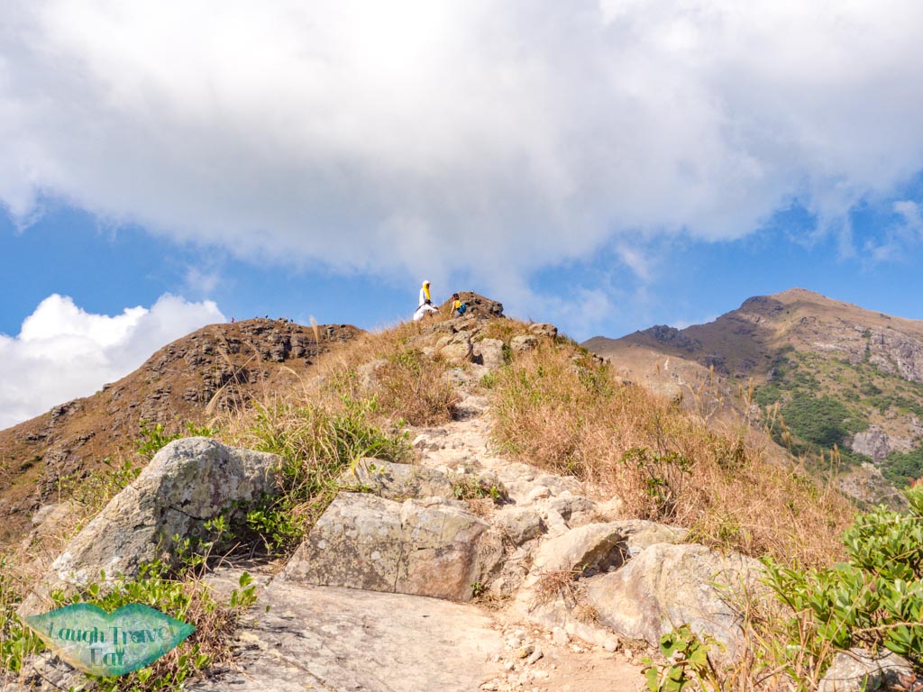 going up to one line of survivability kau nga range trail lantau island hong kong - laugh travel eat