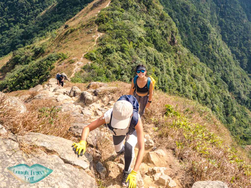 going up to one line of survivability kau nga range trail lantau island hong kong - laugh travel eat