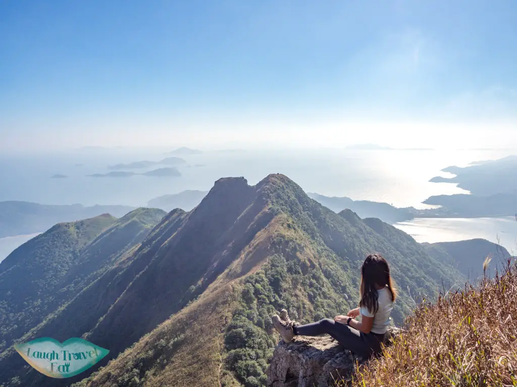 looking back at one line of survivability kau nga range trail lantau island hong kong - laugh travel eat