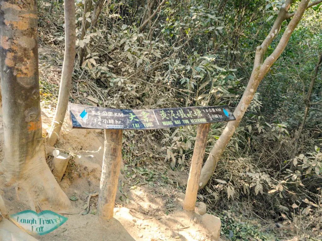 signpost next to reservoir island viewpoint tai lam country park yuen long hong kong - laugh travel eat