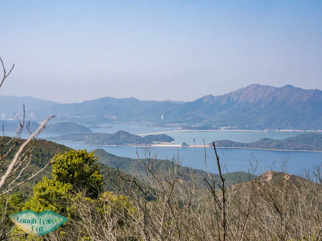 plover cove reservoir view from unanmed peak to shek uk shan sai kung hong kong - laugh travel eat