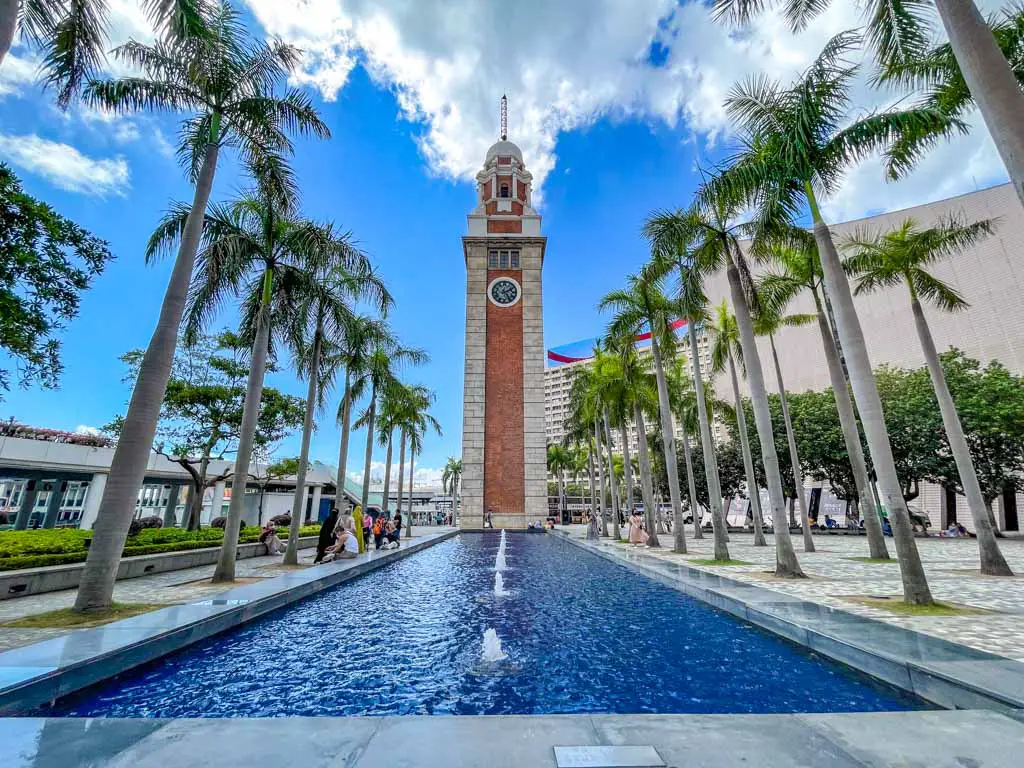 clock tower and fountain tsim sha tsui hong kong - laugh travel eat