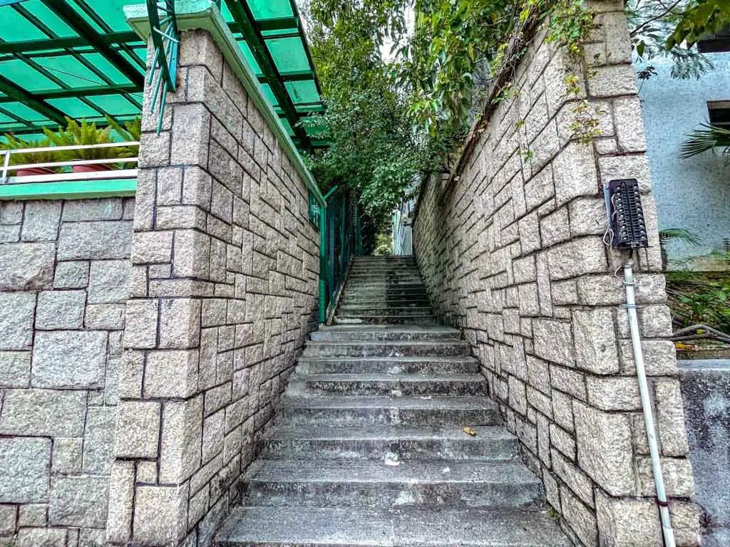 junction road stairs to go to checkerboard hill kowloon hong kong - laugh travel eat