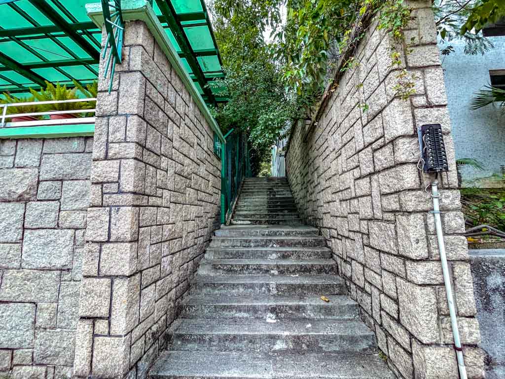 junction road stairs to go to checkerboard hill kowloon hong kong - laugh travel eat