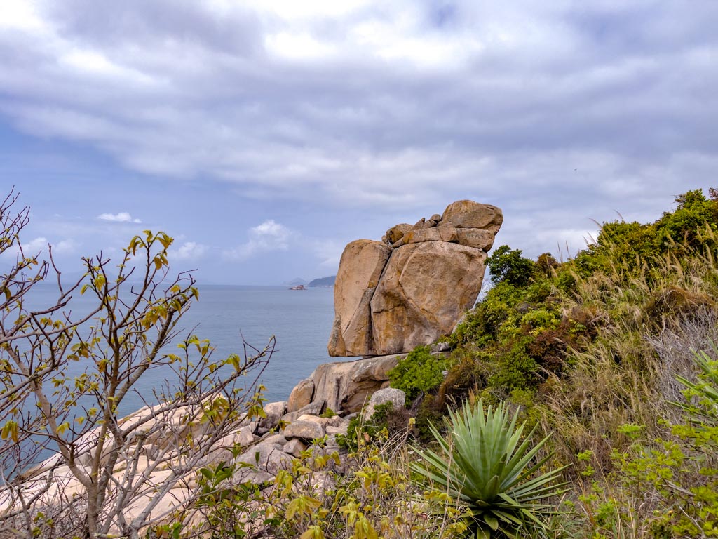 conch rock po toi island hong kong - laugh travel eat