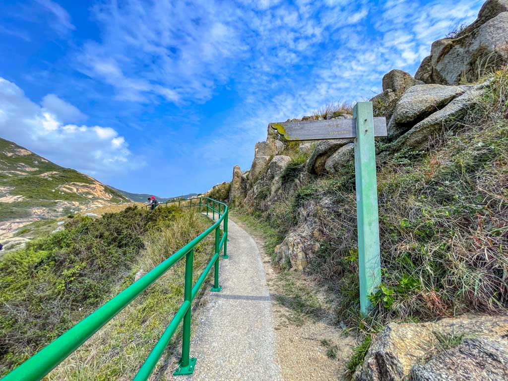 sign for Buddha's hand rock route 1 po toi country trail po toi island hong kong - laugh travel eat