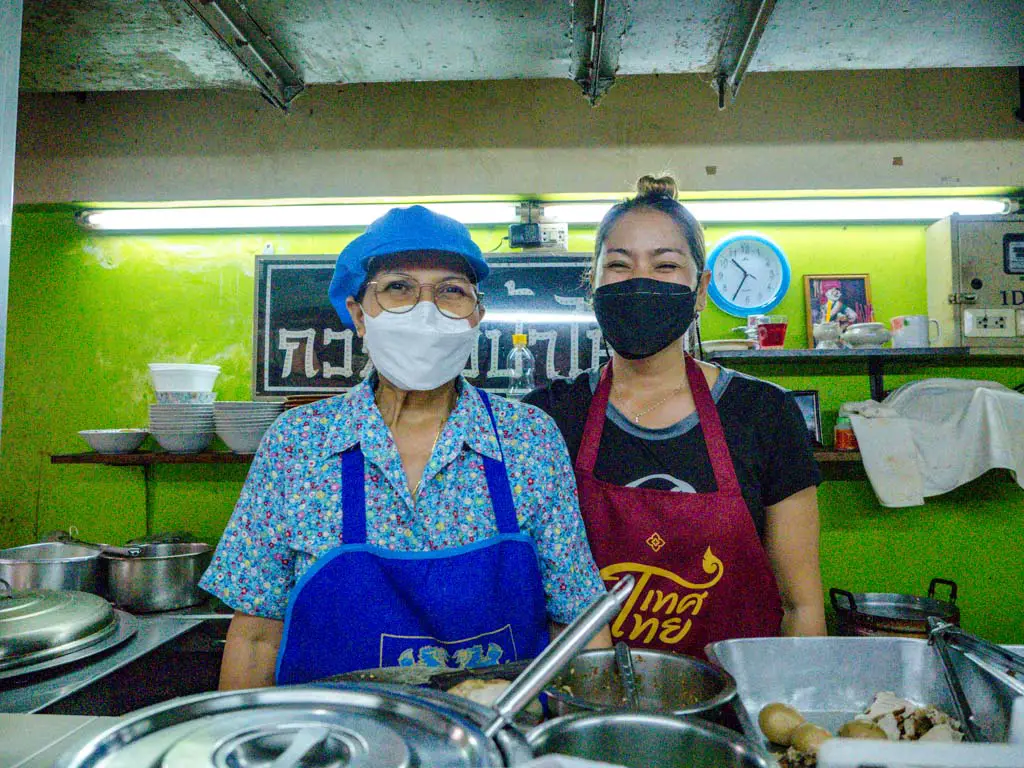 mother daughter duo at central market rice noodle stall a chefs tour southern flavours phuket town thailand laugh travel eat