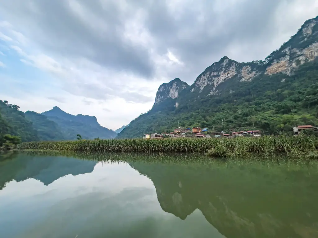 view of village on river ba be lake ba be lake view homestay ba be lake ba be national park Vietnam - laugh travel eat