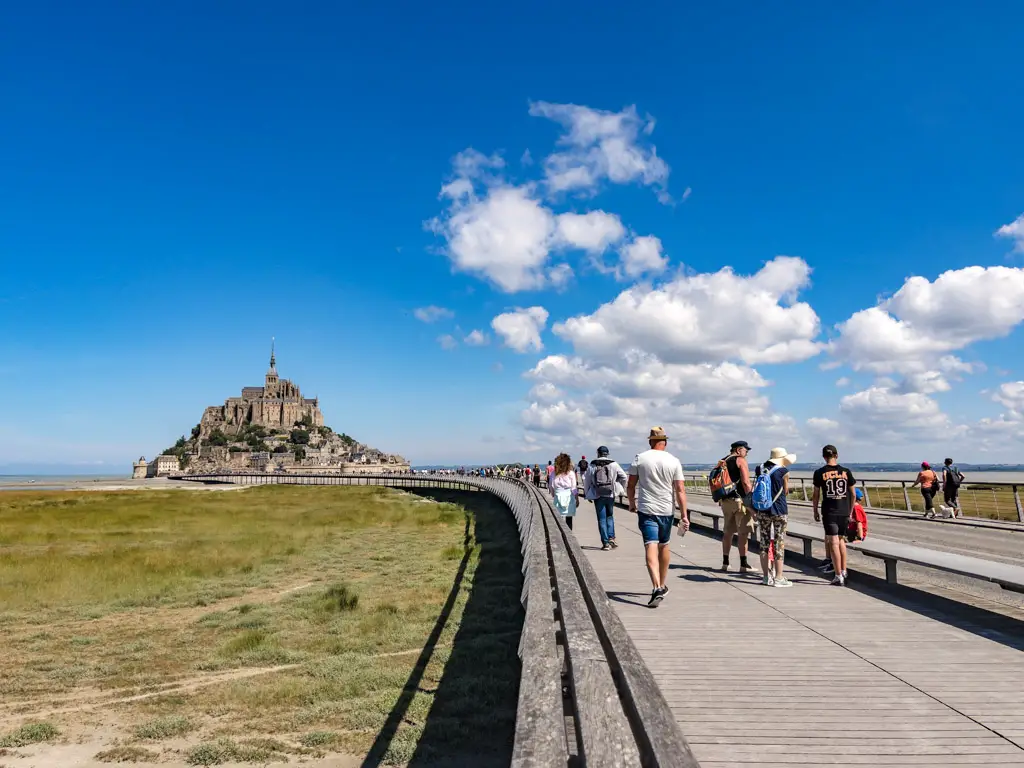 walking to mont saint michel Normandy France - laugh travel eat