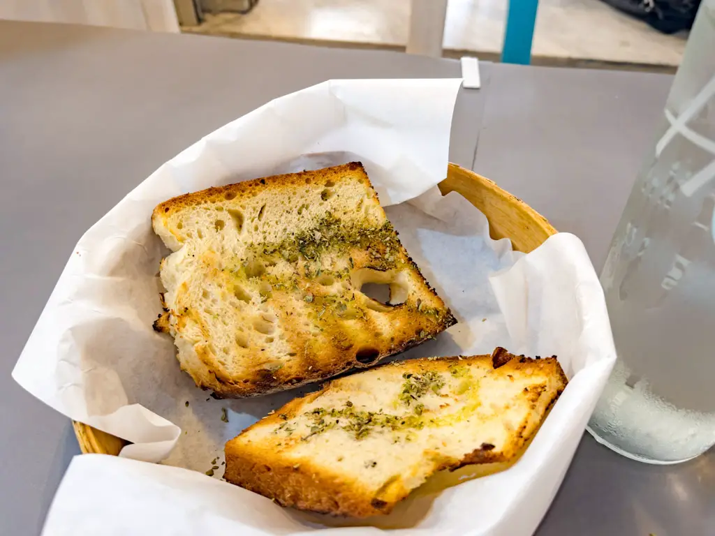 garlic bread tpata fish tavern athens greece - laugh travel eat