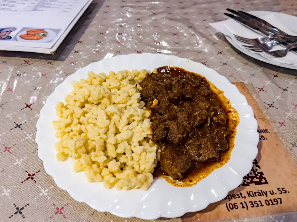 goulash with noodles frici papa restaurant budapest hungary - laugh travel eat