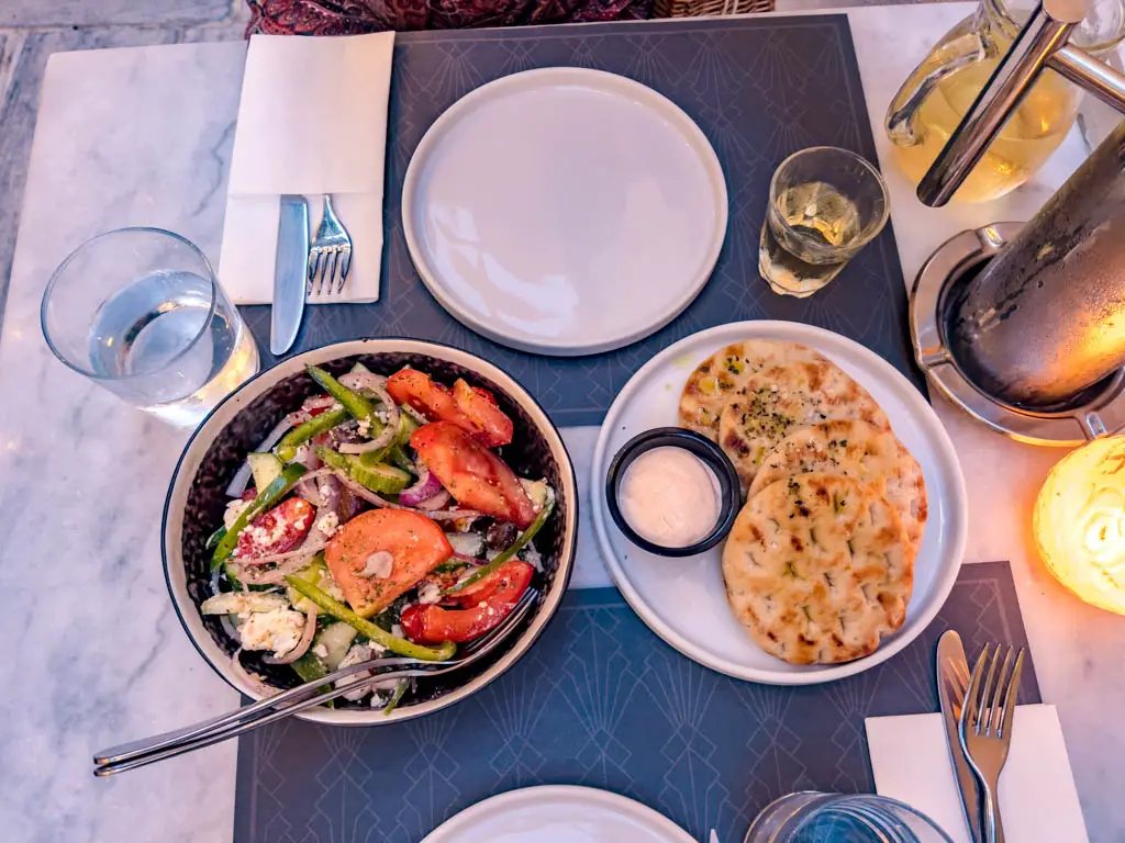 pita bread and side dishes lyra restaurant plaka athens greece - laugh travel eat