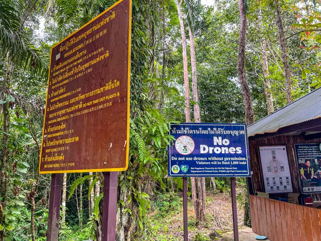 no drone sign by ticket booth dragon crest mountain krabi thailand - laugh travel eat