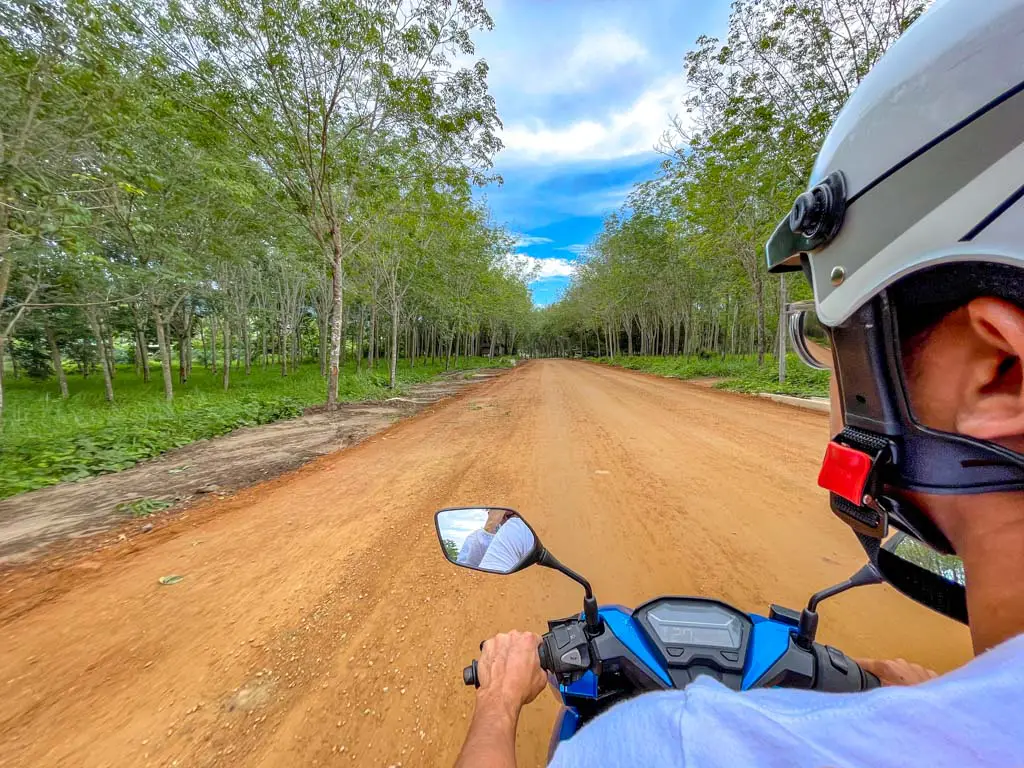 scooter ride to dragon crest mountain krabi thailand - laugh travel eat