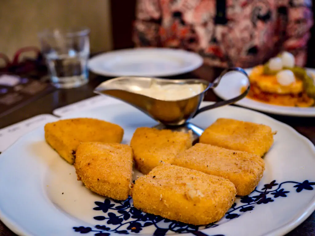 traditional fried cheese with tartar sauce beer hall Food tour in Prague Hungary - laugh travel eat