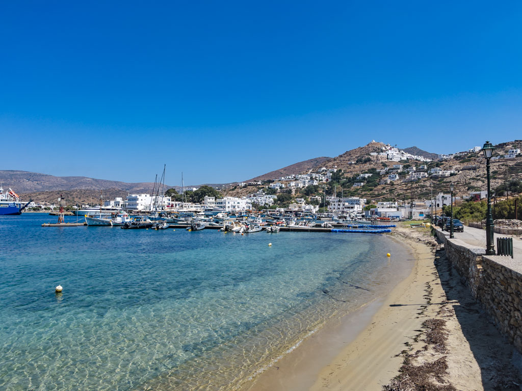 beach by agia irini ios island greece - laugh travel eat