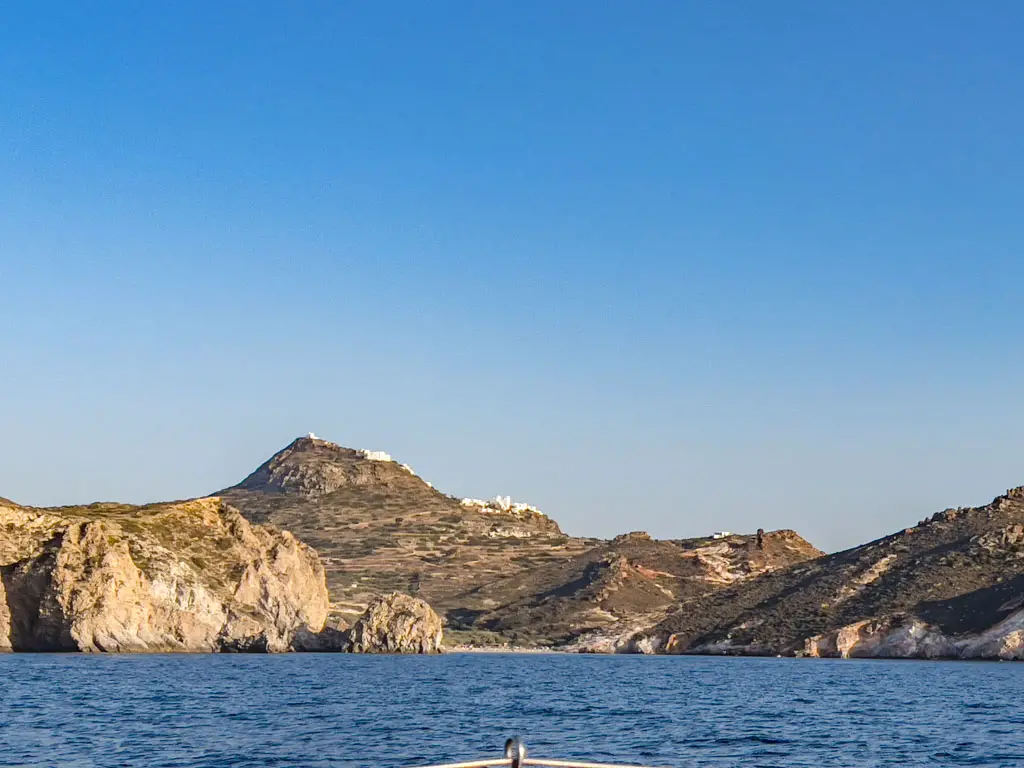 plaka from afar milos greece - laugh travel eat