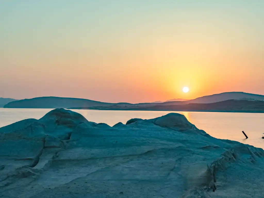 sunrise at sarakiniko beach milos greece - laugh travel eat